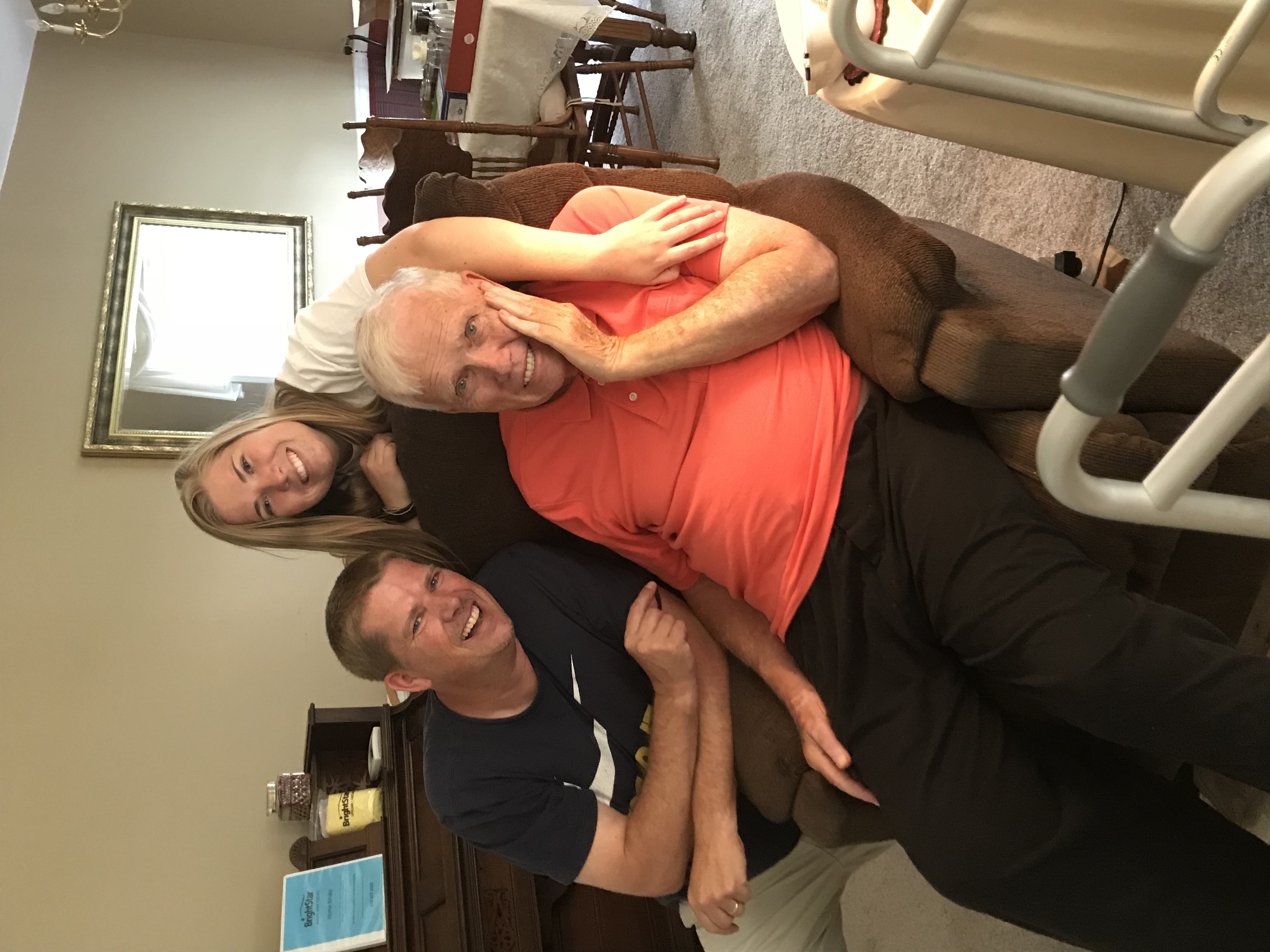 Karl Lee, Amy Katherine Lee, and Amy's grandfather — three generations sharing a joyful moment together